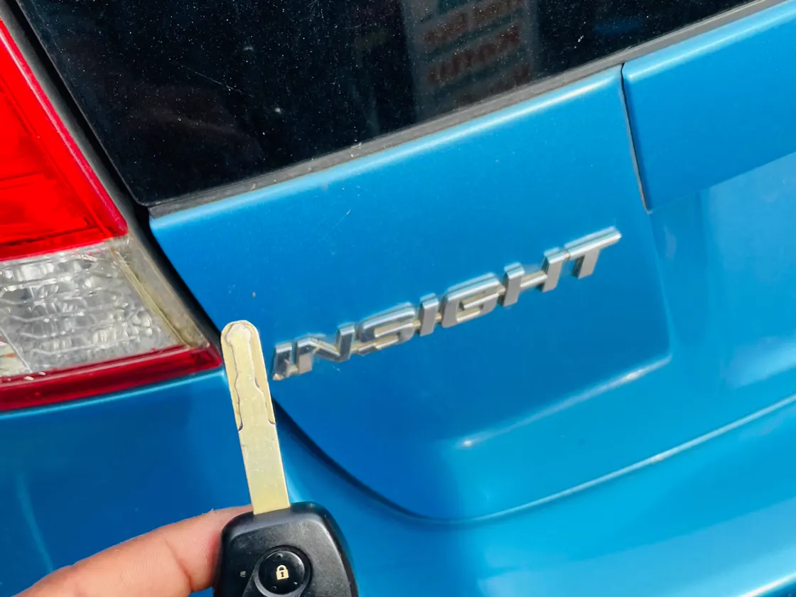 Remote key beside a Honda Insight