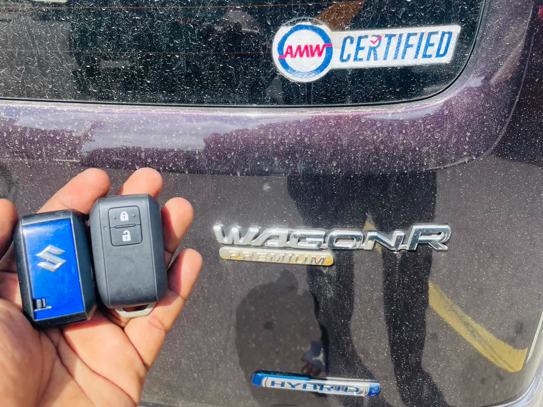 Smart-key fobs beside a Suzuki Wagon R
