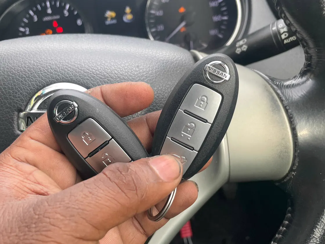Two Nissan remote key fobs
