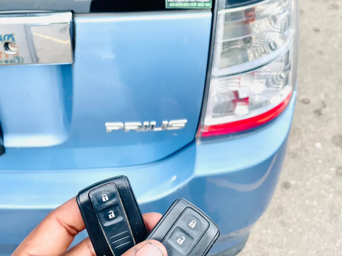 Remote keys beside a Toyota Prius